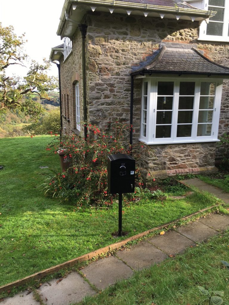 Standard-on-a-Post-outside-a-cottage-rotated